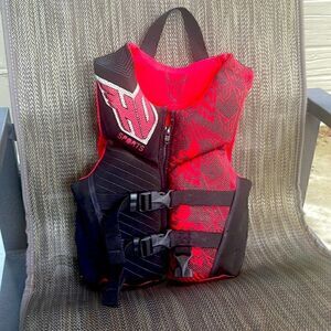 HO Sports life jacket size child 30-50 lbs. coastguard approved, unisex colors.